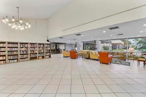 a living room with furniture a table and chairs