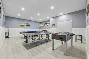 2236 North Cypress Bend Drive, Unit 311 Pompano Beach, FL 33069 - Photo 33 of 56 a view of a kitchen with dining table and chairs