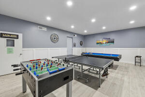 2236 North Cypress Bend Drive, Unit 311 Pompano Beach, FL 33069 - Photo 34 of 56 a room with table tennis pool table and arcade game machine