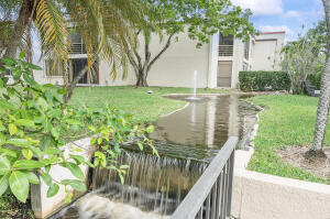 2236 North Cypress Bend Drive, Unit 311 Pompano Beach, FL 33069 - Photo 41 of 56 a view of swimming pool from a balcony