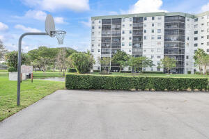 2236 North Cypress Bend Drive, Unit 311 Pompano Beach, FL 33069 - Photo 43 of 56 a view of a building with garden