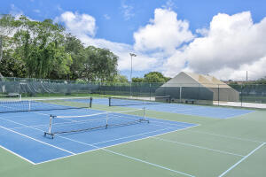 2236 North Cypress Bend Drive, Unit 311 Pompano Beach, FL 33069 - Photo 44 of 56 a view of a tennis court