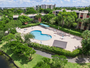 2236 North Cypress Bend Drive, Unit 311 Pompano Beach, FL 33069 - Photo 51 of 56 an aerial view of a house with garden space and street view