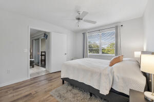 2236 North Cypress Bend Drive, Unit 311 Pompano Beach, FL 33069 - Photo 10 of 56 a bedroom with a bed and a window