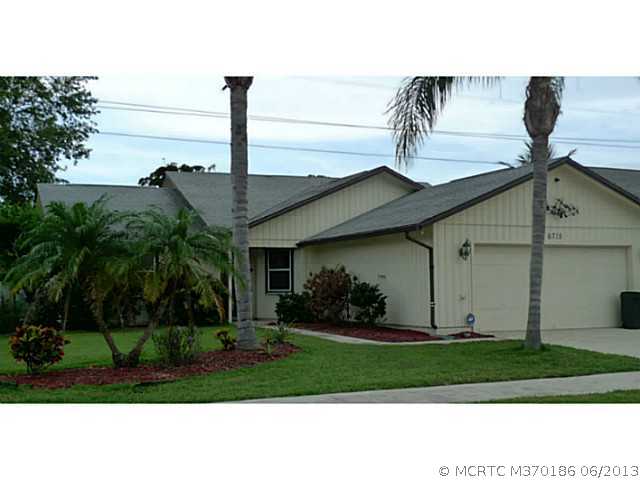 6715 Southeast Raintree Avenue Stuart, FL 34997 - Photo 2 of 12 Exterior Front. Crisp And Clean Exterior