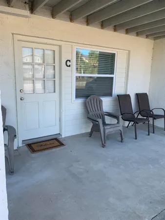 a view of workspace with furniture and window