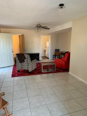 a bedroom with furniture and window