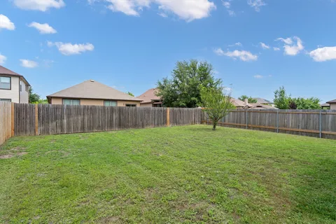 a view of a backyard with green space