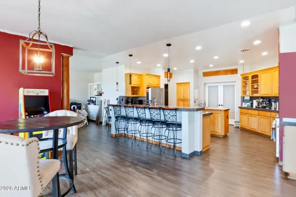 a view of a dining room with furniture wooden floor and chandelier