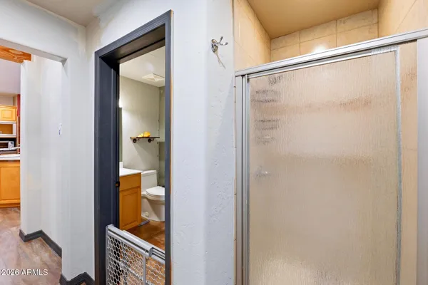 a kitchen with stainless steel appliances granite countertop a stove and a wooden floors