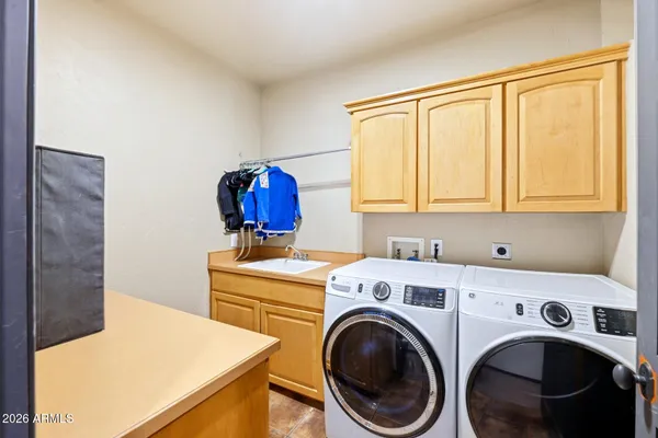 a bedroom with furniture and wooden floor
