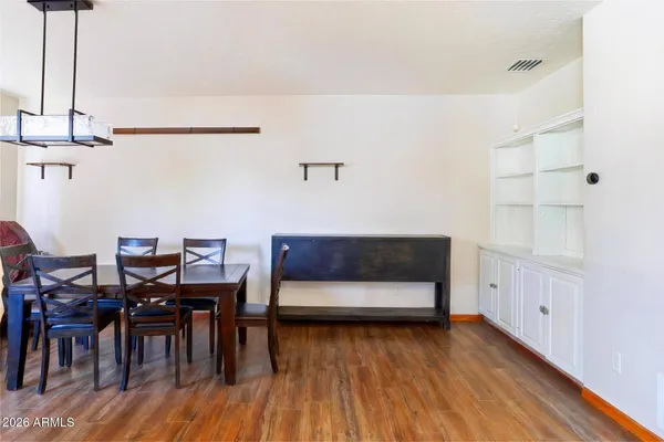 a bathroom with a sink toilet and mirror