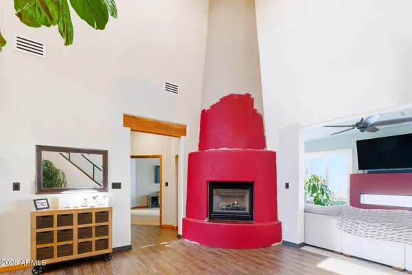 a view of a livingroom with furniture and a flat screen tv