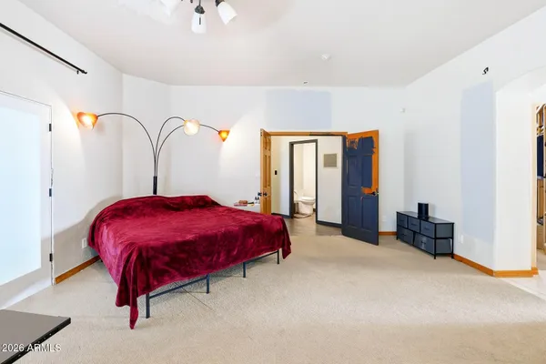 a spacious bathroom with a double vanity sink a mirror and shower