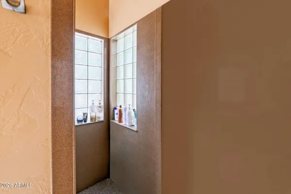a bathroom with a sink mirror and vanity