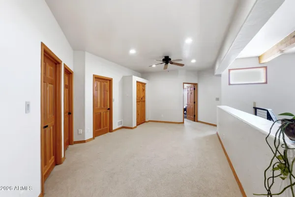a spacious bathroom with a double vanity sink a mirror a vanity and a bathtub