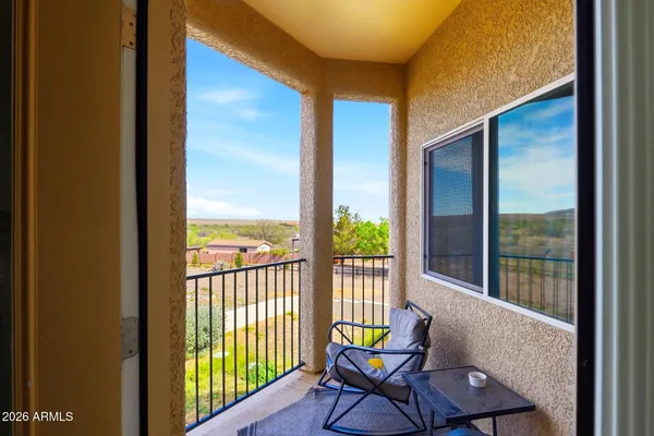 a view of a house with backyard outdoor seating area