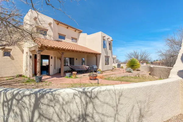 a view of a pathway with a yard