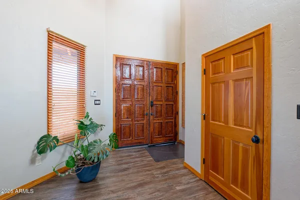 a view of front door with wooden floor