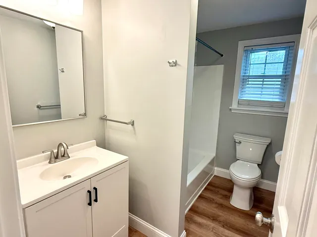 a bathroom with a sink toilet and a shower