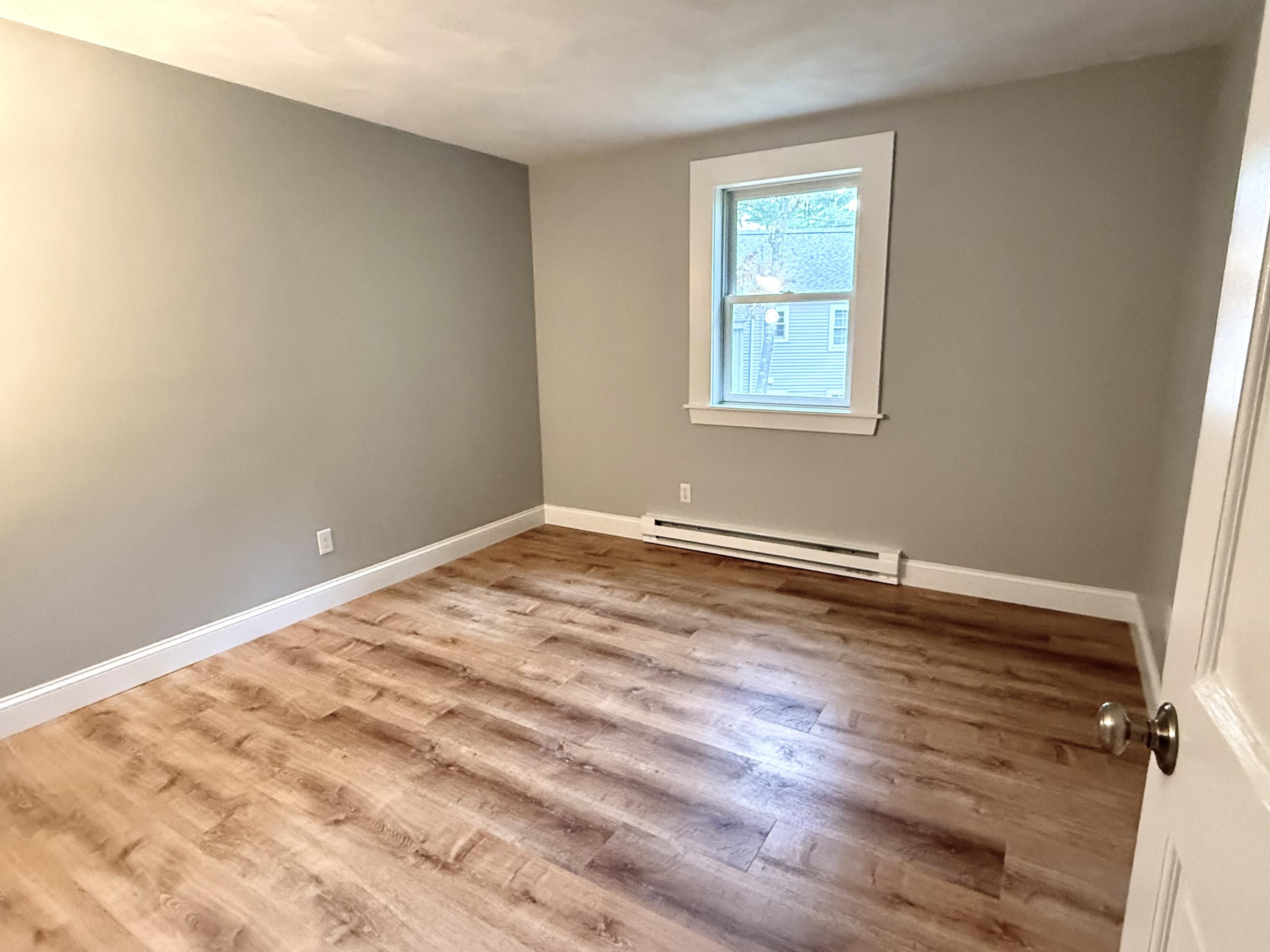 70 Cape Drive, Unit 4C Mashpee, MA 02649 - Photo 5 of 6 a view of a room with wooden floor and window