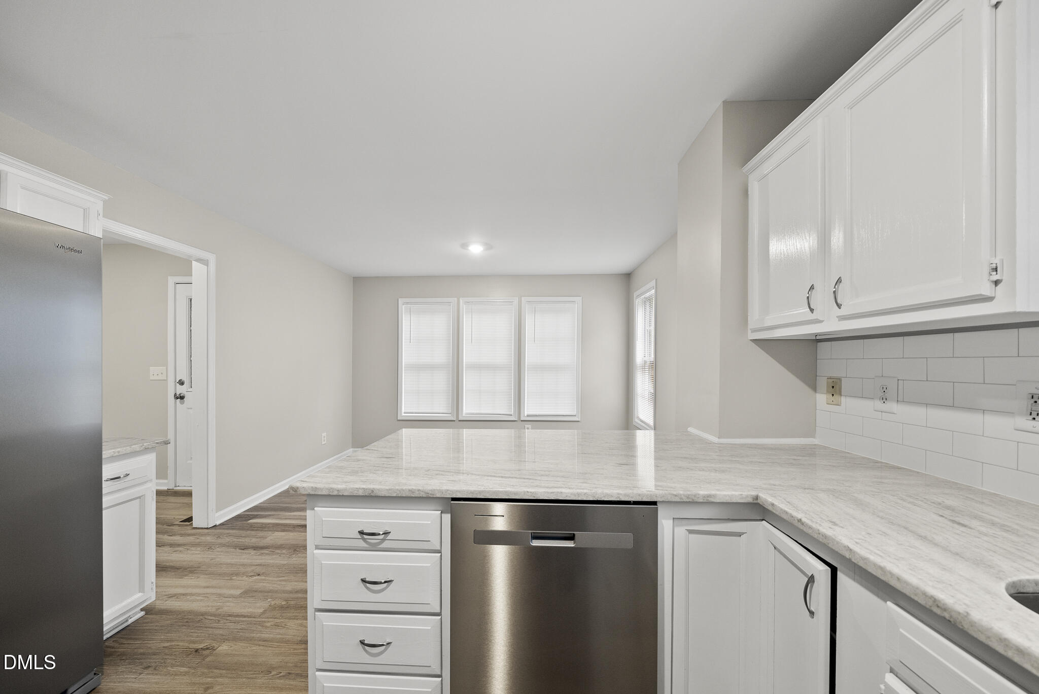 201 Tonylee Court, Unit B Raleigh, NC 27603 - Photo 12 of 29 a kitchen with stainless steel appliances granite countertop a sink and a stove