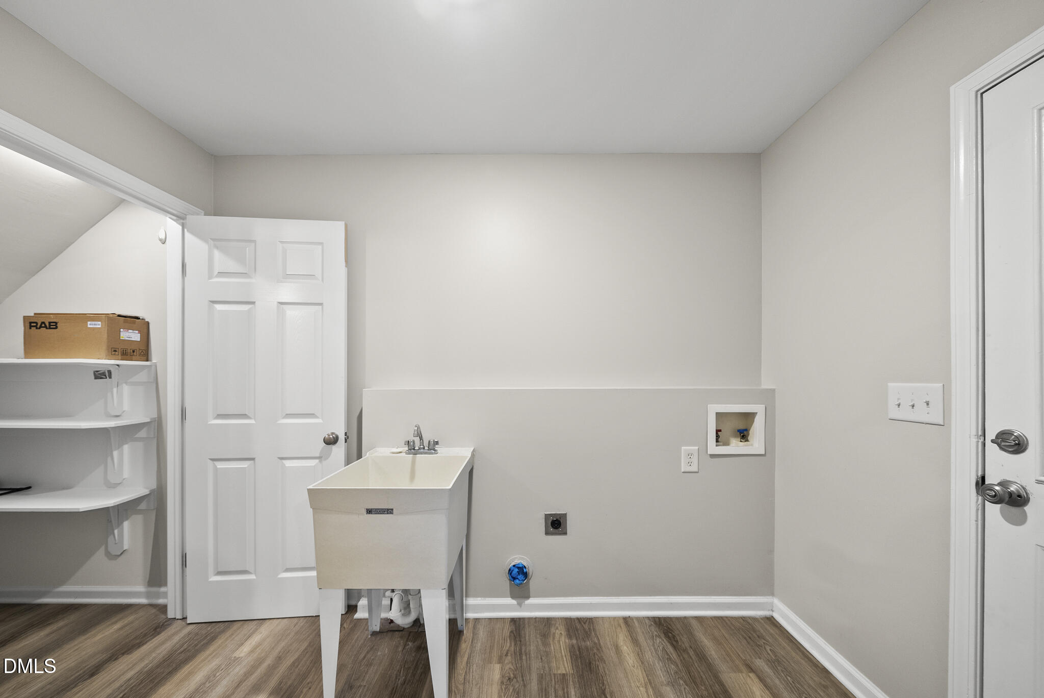 201 Tonylee Court, Unit B Raleigh, NC 27603 - Photo 16 of 29 a bathroom with a sink and a mirror