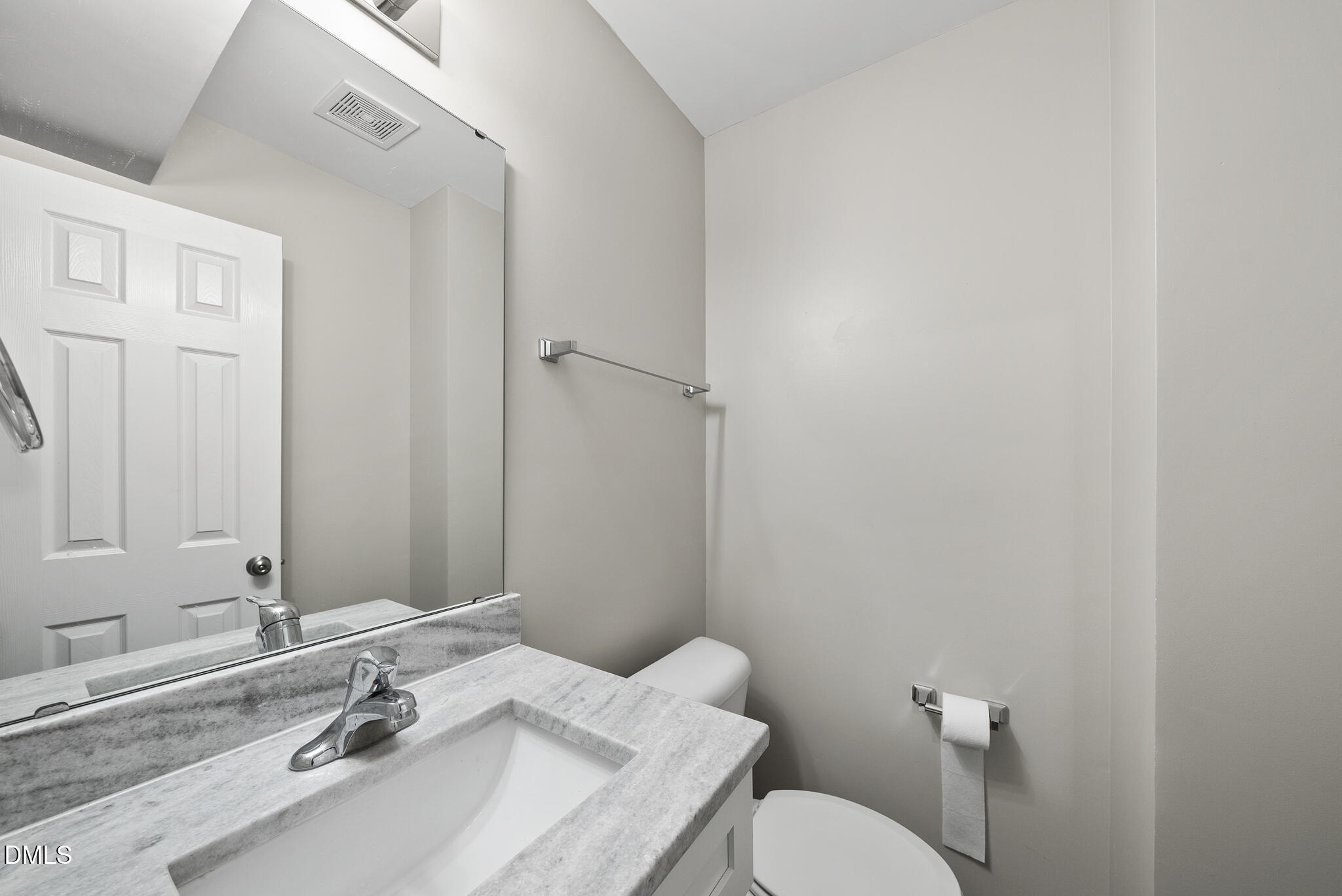 201 Tonylee Court, Unit B Raleigh, NC 27603 - Photo 18 of 29 a bathroom with a sink and a toilet