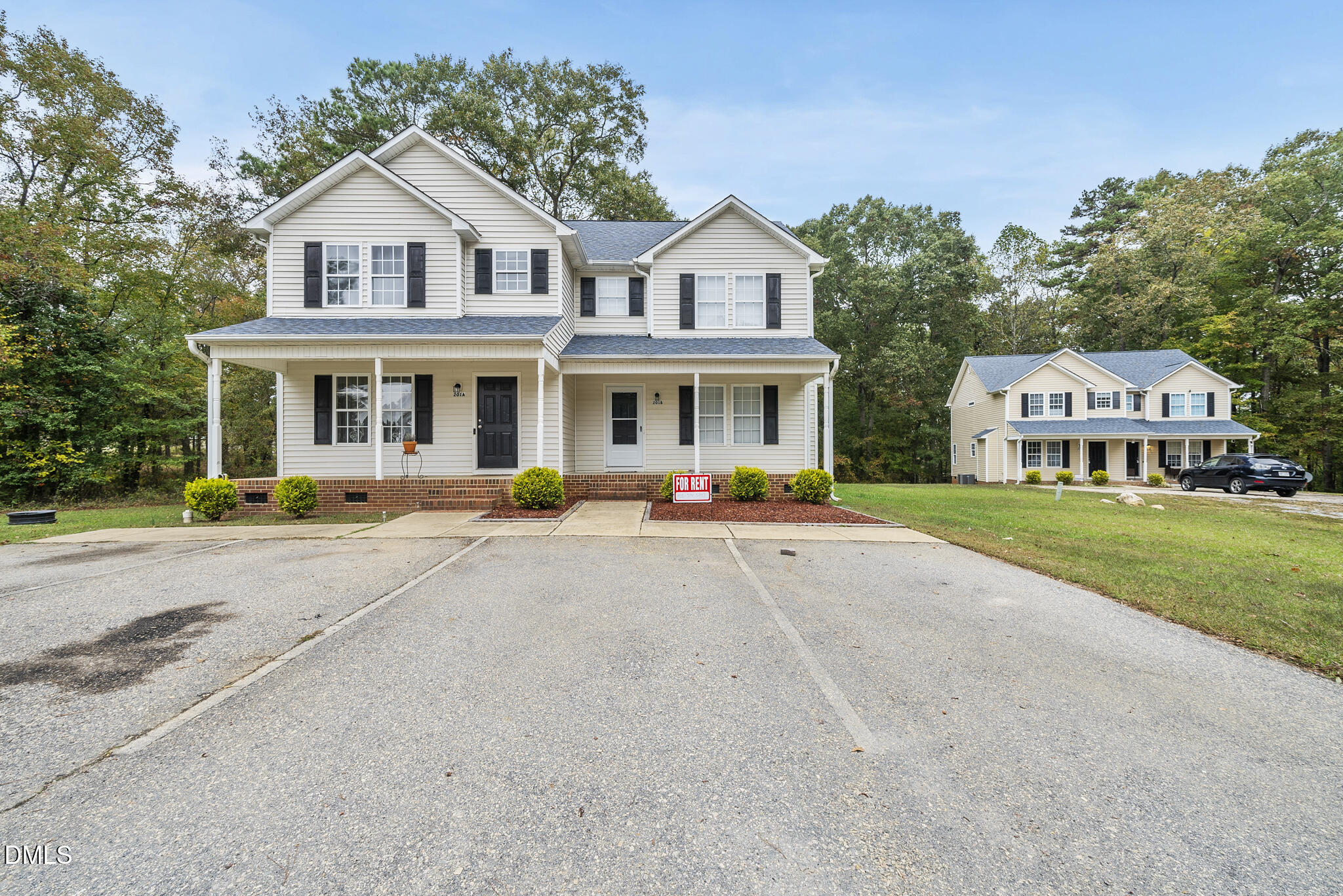 201 Tonylee Court, Unit B Raleigh, NC 27603 - Photo 2 of 29 a front view of a house with a garden and plants