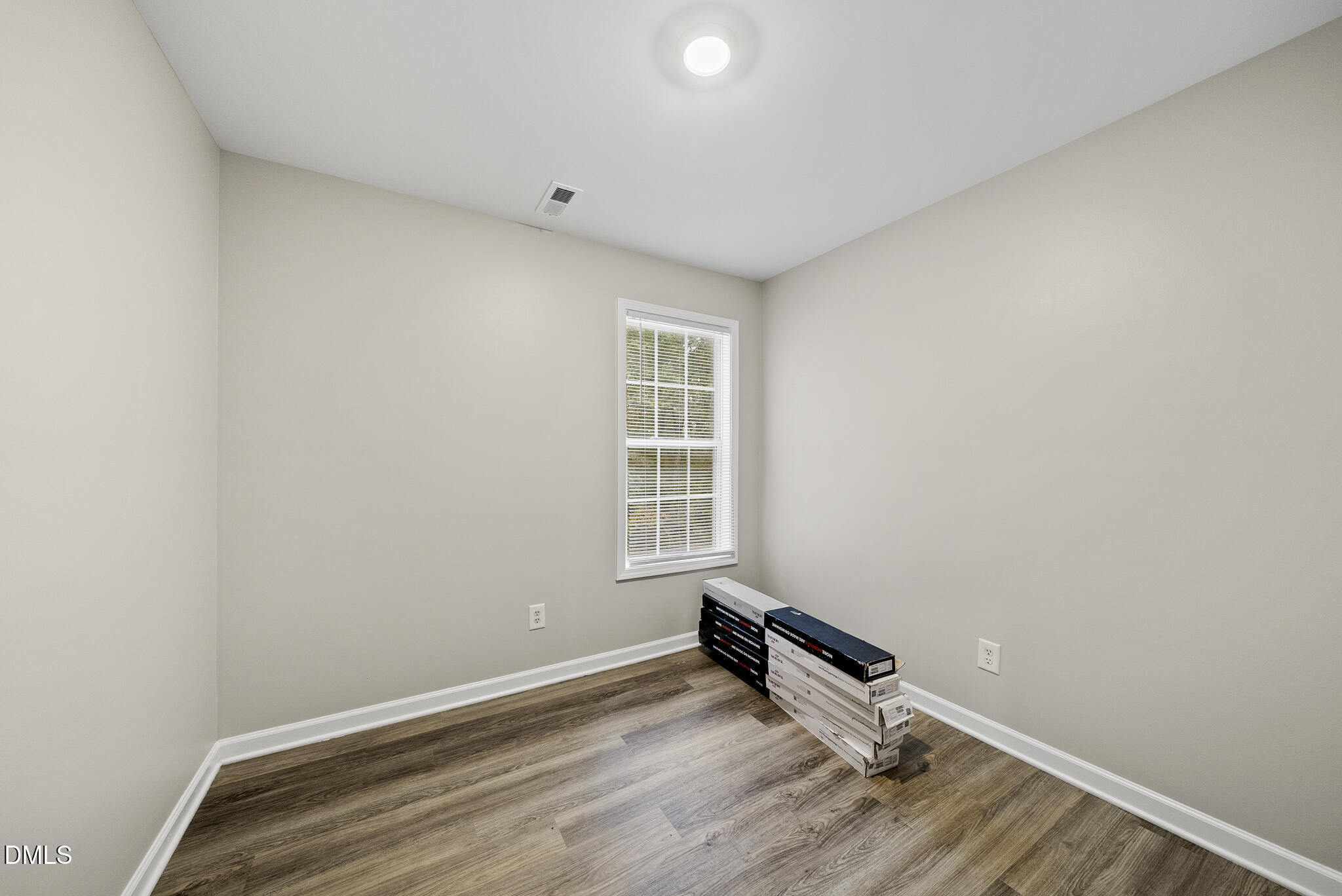 201 Tonylee Court, Unit B Raleigh, NC 27603 - Photo 23 of 29 an empty room with a window