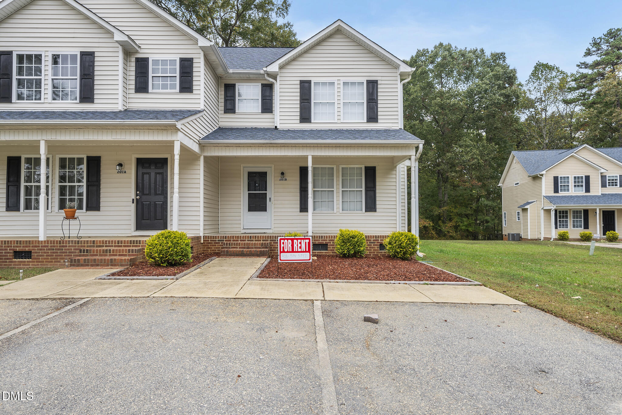 201 Tonylee Court, Unit B Raleigh, NC 27603 - Photo 3 of 29 a front view of a house with yard
