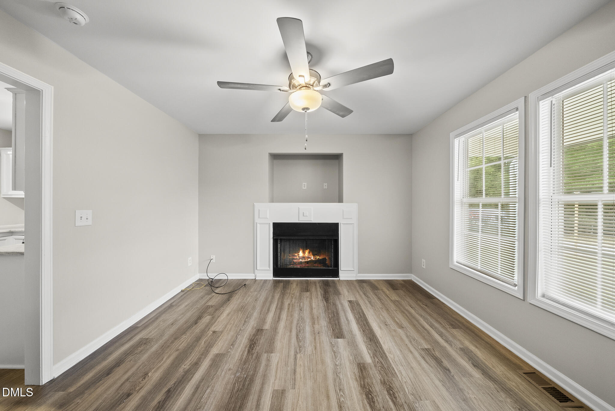 201 Tonylee Court, Unit B Raleigh, NC 27603 - Photo 6 of 29 a view of an empty room with a window and fireplace