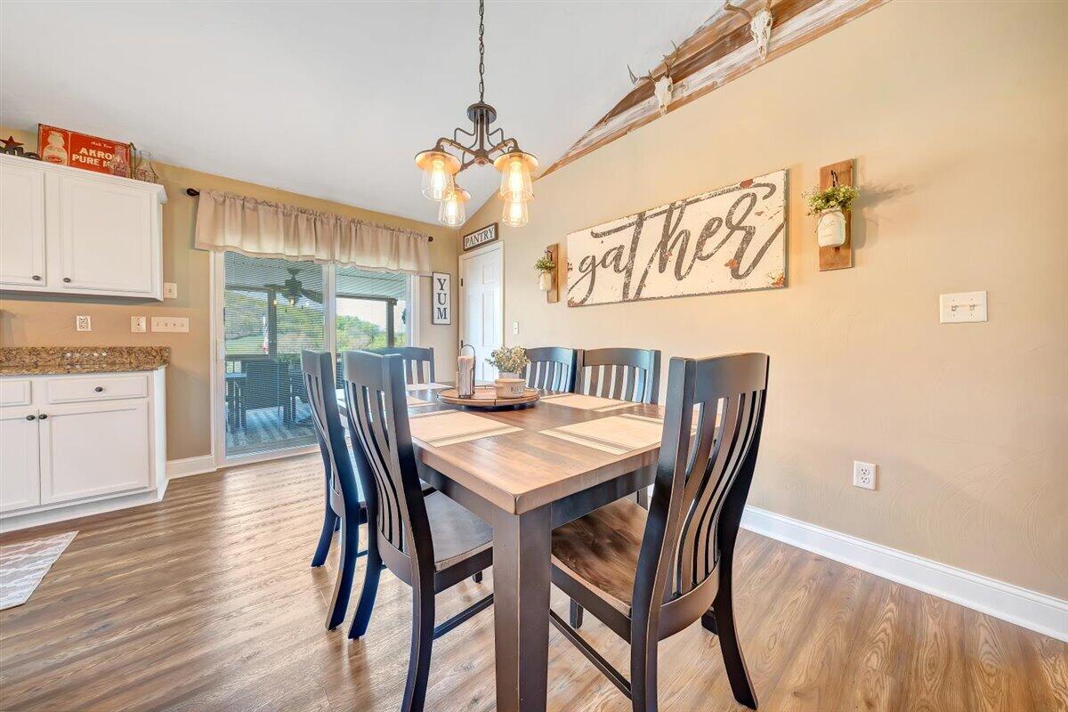 2947 Sandy Level Road Goodview, VA 24095 - Photo 14 of 73 a view of a dining room with furniture window and wooden floor