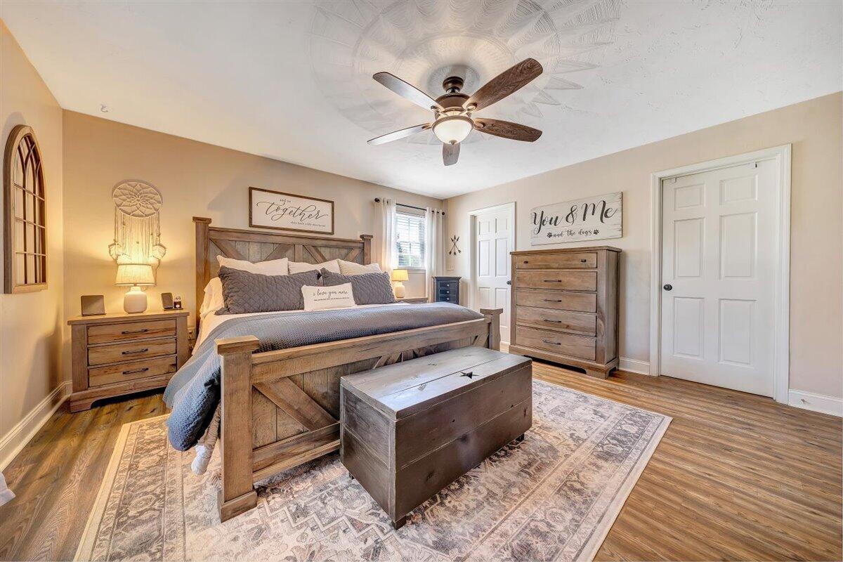 2947 Sandy Level Road Goodview, VA 24095 - Photo 22 of 73 a bedroom with a bed and wooden floor