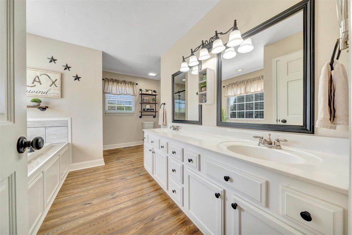 2947 Sandy Level Road Goodview, VA 24095 - Photo 24 of 73 a spacious bathroom with double vanity and a mirror