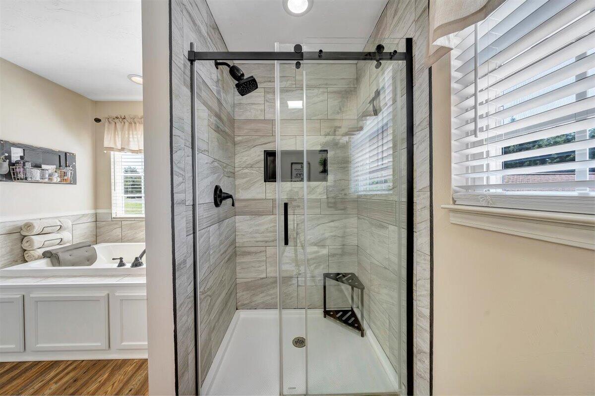 2947 Sandy Level Road Goodview, VA 24095 - Photo 26 of 73 a bathroom with a shower sink and mirror