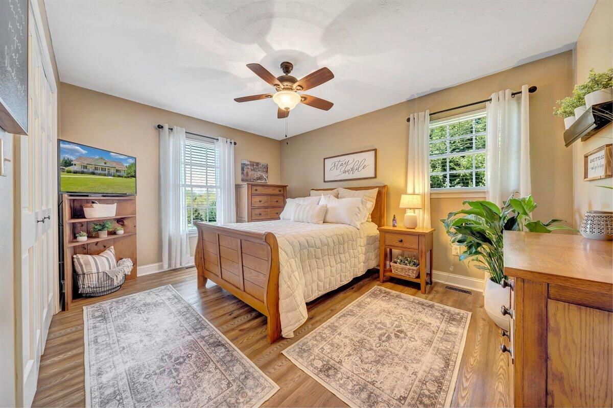 2947 Sandy Level Road Goodview, VA 24095 - Photo 28 of 73 a bedroom with a bed and a potted plant