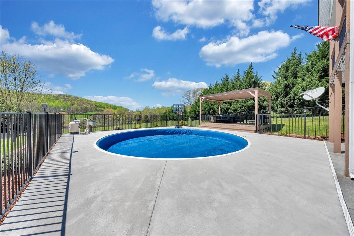 2947 Sandy Level Road Goodview, VA 24095 - Photo 46 of 73 a view of a swimming pool with a patio