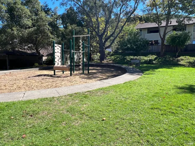 a view of a park with a bench