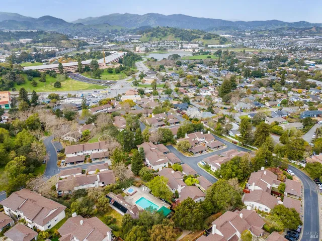 an aerial view of residential houses with outdoor space