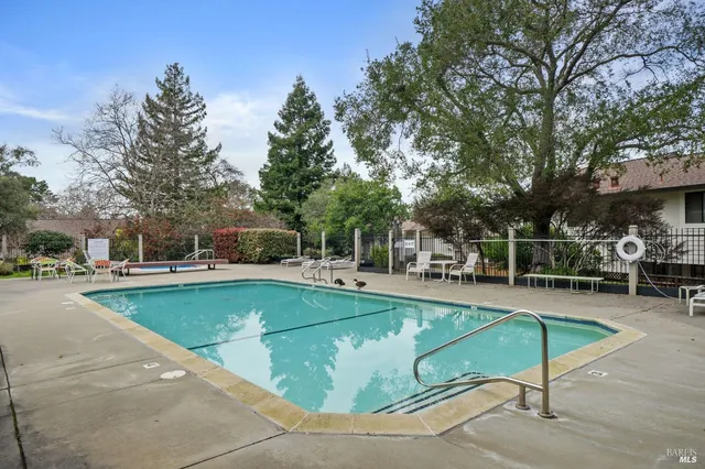 a view of a swimming pool with chairs