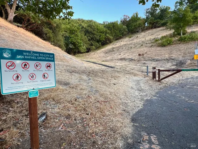 a sign board with a yard