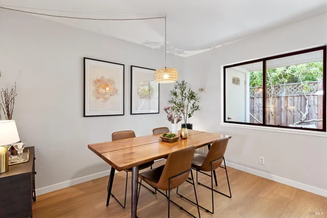 a dining room with furniture and window