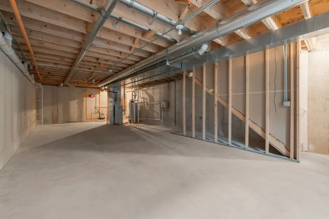 a view of empty room with wooden walls