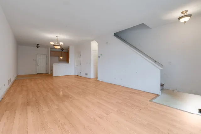 a view of a big room with closet and windows
