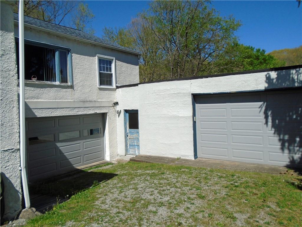 452 Smiths Ferry Road Midland, PA 15059 - Photo 18 of 26 Extra wide garage doors. Possible 4 car parking. Man door leads to 2nd basement under the garage to the right,
