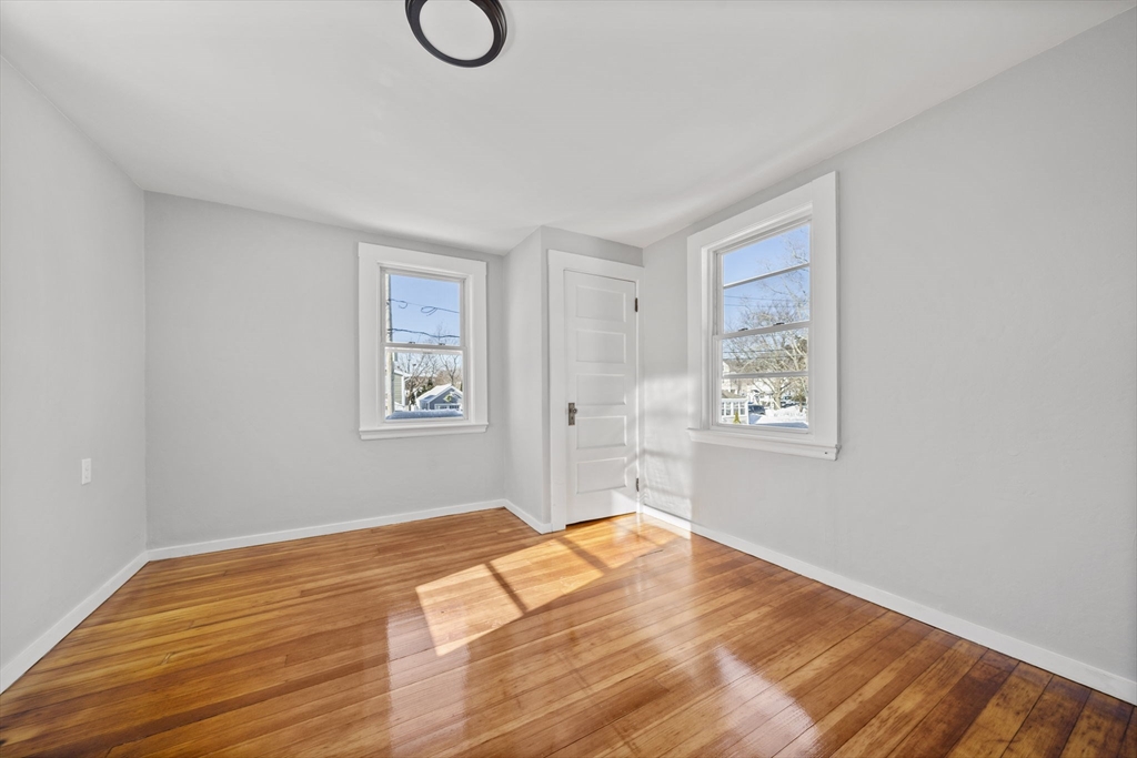 106 Darrow Street Quincy, MA 02169 - Photo 16 of 23 a view of a room with wooden floor and window