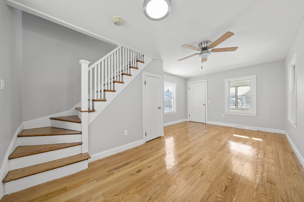 106 Darrow Street Quincy, MA 02169 - Photo 8 of 23 a view of empty room with wooden floor and fan