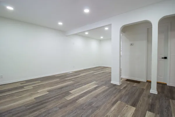 a view of room with wooden floor