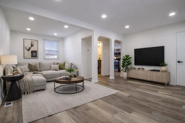 a living room with furniture and a flat screen tv